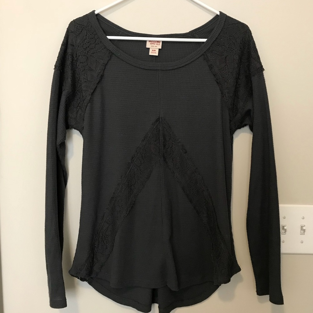 Long-sleeve gray top with lace detail.